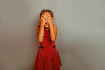 Fototapeta premium Girl European appearance decade closed eyes with his hands opene