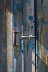 Old wooden blue door with handle
