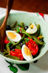 Salad from green beans with olives and egg