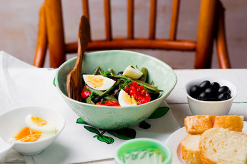 Salad from green beans with olives and egg