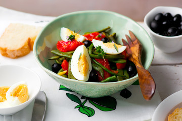 Salad from green beans with olives and egg