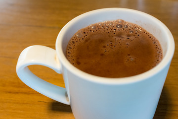 Pure hot chocolate in a white mug