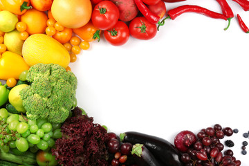 Heap of fruits and vegetables isolated on white