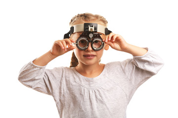 Young girl undergoing eye test with Spectacles isolated on white