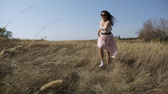 young beautiful girl in the field slow motion