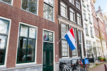 The flag of the Netherlands on a building during King's Day. © lornet