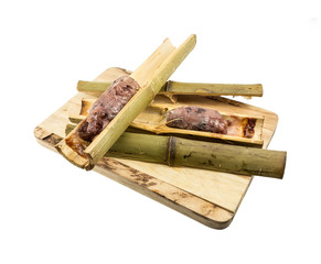 Glutinous rice roasted in bamboo joints (Khoalam) isolated on white background