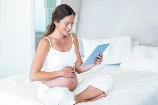 Happy woman using tablet pc