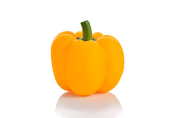 Sweet yellow pepper with water drops over white background