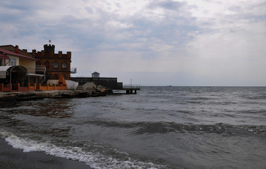 Fototapeta premium Summer house on the sea coast in the evening