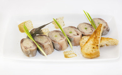 appetizer of herring stuffing on a table in a restaurant