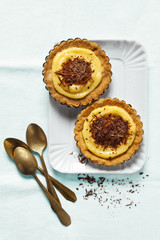 Dessert Tarts with lemon curd and chocolate. copy space