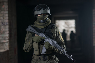 Fully equipped military men with automatic weapons playing