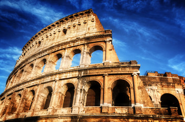 Colosseum in Rome, Italy. Amphitheatre over deep blue sky - obrazy, fototapety, plakaty