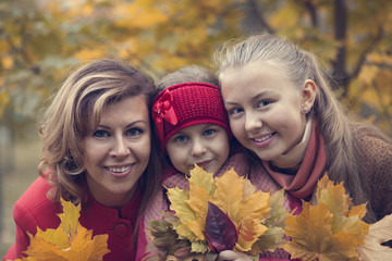 Happy family in fall park 