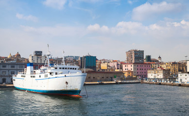 Fototapeta na wymiar Port of Naples, coastal view with white ferry