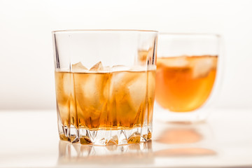 Two different glasses of whiskey 
