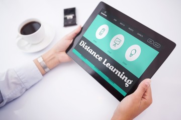 Composite image of man using tablet pc