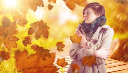 Naklejka na ściany i meble Composite image of thoughtful woman in winter coat