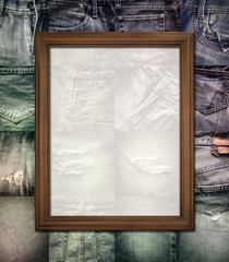 Wooden picture frame on collage jeans