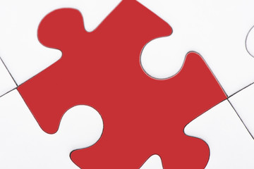 Puzzle pieces, one red piece