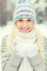 smiling young woman in winter forest