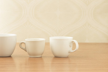 Empty coffee cups on wooden table