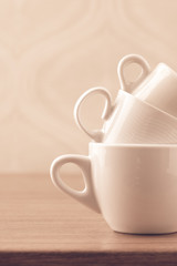 Empty coffee cups on wooden table