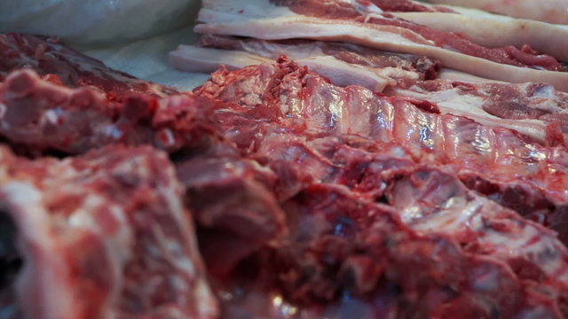 fresh red pork meat selling in local Asian market, unhygienic food
