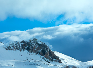 Fototapeta na wymiar Winter mountain slope with ski track.