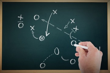 Composite image of business man writing with chalk
