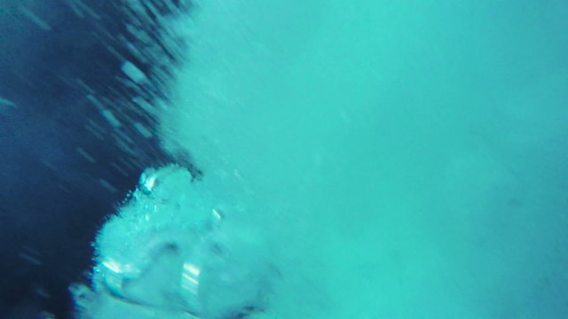 Athletic Young Man Jumping From Cliff Into Ocean Sea Water Muscular Adventure Extreme Sports Lifestyle Hobby Vacation Clear Beach Slow Motion Leisure Activity Gopro HD