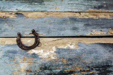 old horseshoe on a wooden background