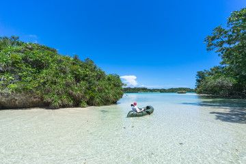 Fototapeta na wymiar Kayaking on clear tropical water, Ishigaki Island, Okinawa, Japan