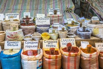 Vivid oriental central asian market with bags full of various sp