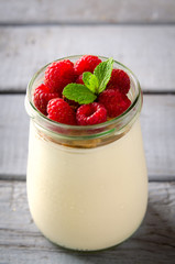 Healthy breakfast - fresh Greek yogurt with raspberries and mint