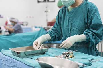 Fototapeta na wymiar scrub nurse prepare medical instruments