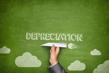 Depreciation concept on blackboard with paper plane