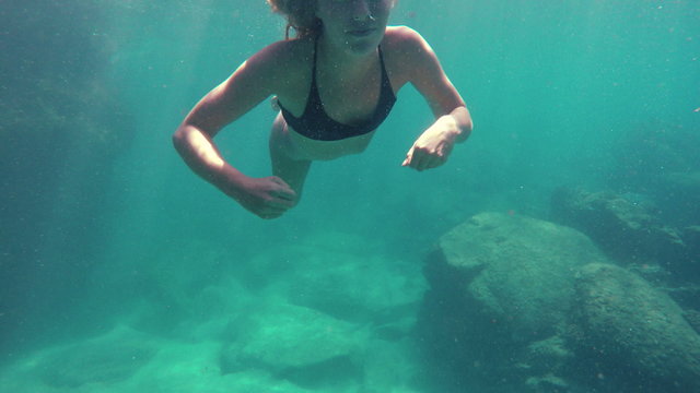Woman Swimming Underwater in 4K Towards Camera Beautiful Attractive Female