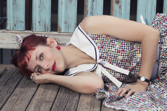 pinup young woman in vintage style clothing