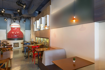 Interior of a pizza restaurant with wood fired oven