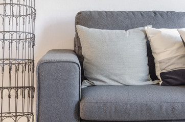 modern grey sofa with pillows