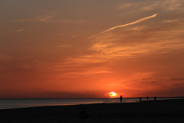Naklejka na ściany i meble Sunset over beach