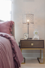 classic lamp style on wooden table side in bedroom