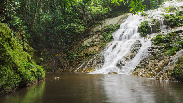 Fototapeta Beautiful waterfall in tropical rinforest in Malaysia