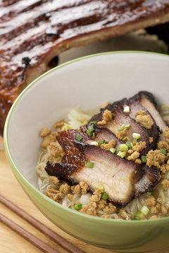 Pork Flat Rice Noodles with BBQ Ribs in Background
