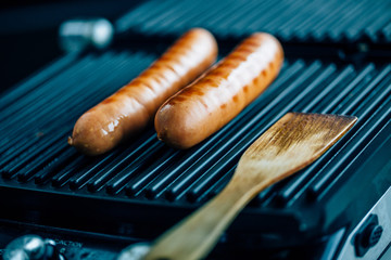 sausages on the grill