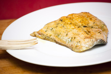 Grilled salmon on a white plate
