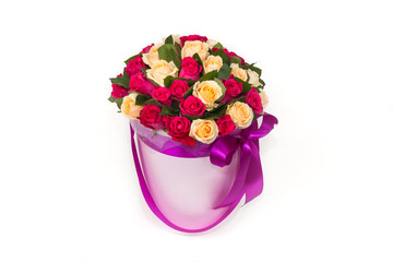 deluxe bucket of red and yellow roses on white background