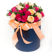 deluxe bucket of red and yellow roses on white background